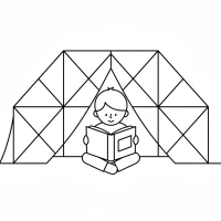 A child reading a book inside a snug blanket fort.